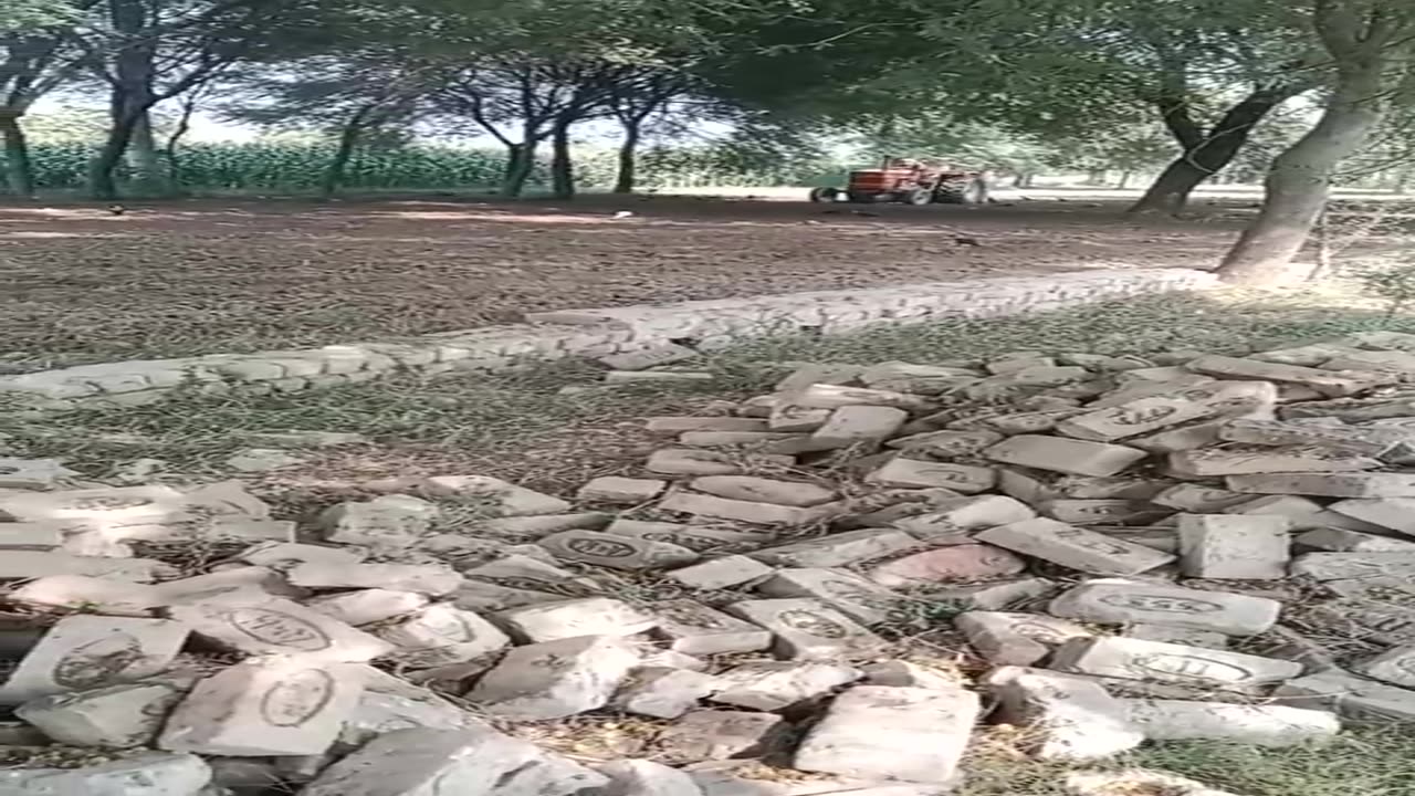 Beautiful village view tractor preparing field