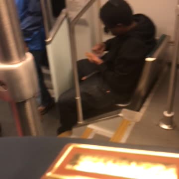 Man with weed in hand in front of babies