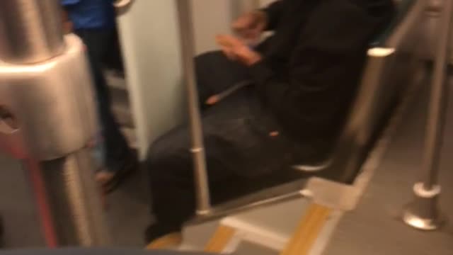 Man with weed in hand in front of babies