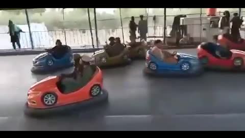 Taliban in Afghanistan Play with Cars in Amusement Park in Kabul