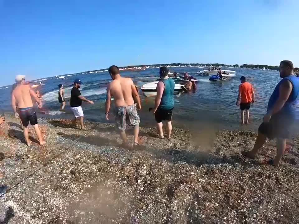 Beach Goers Band Together to Save a Boat