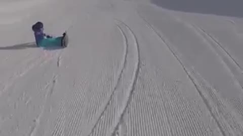 Woman blue jacket snowboard tumble