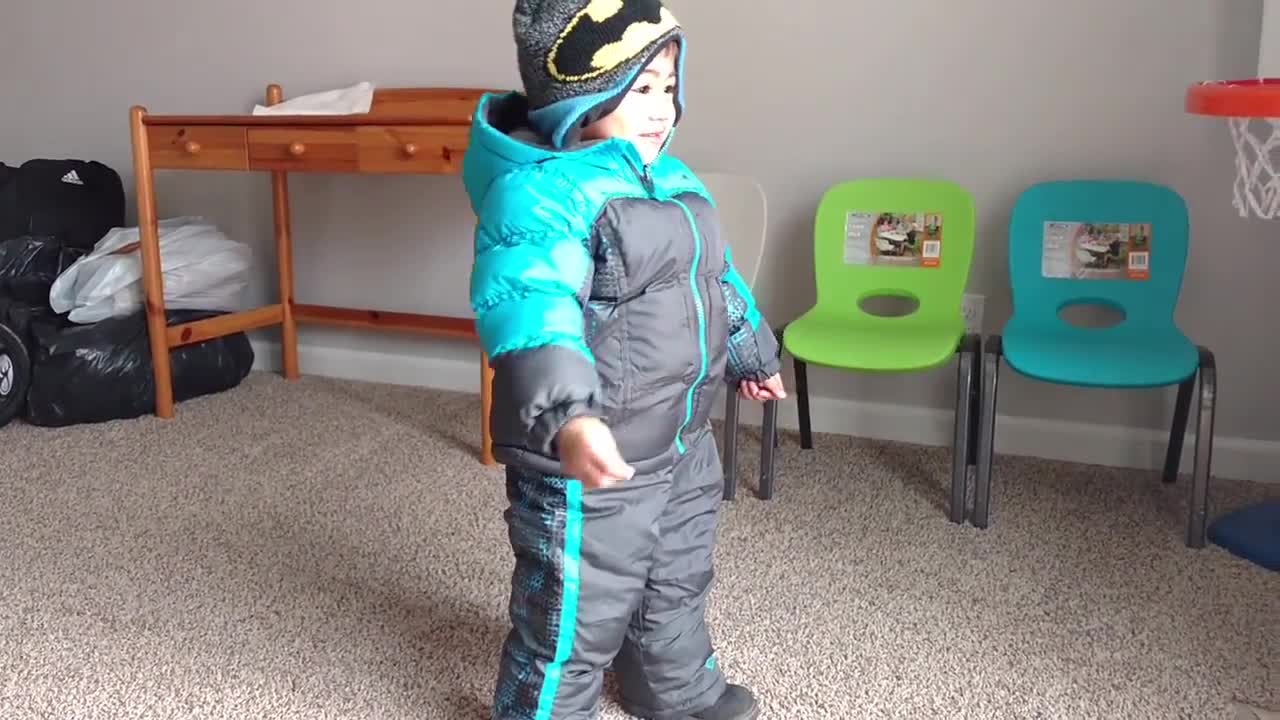 Toddler Tries Out New Snowsuit