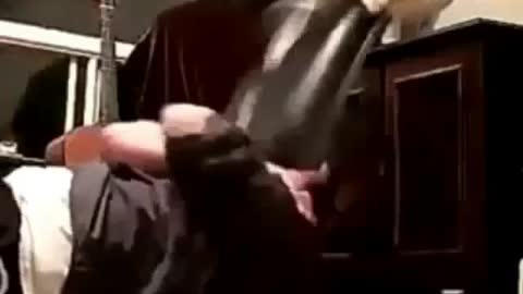 The Cat accidentally dropped the TV on Owner's face While he is doing Exercise