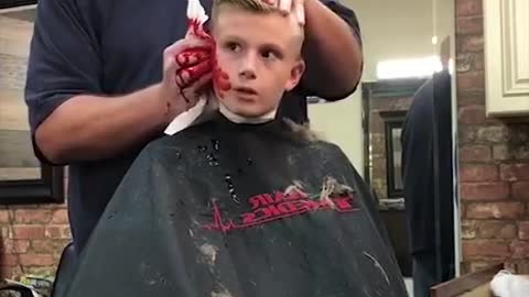 The barber shaved his youngest child