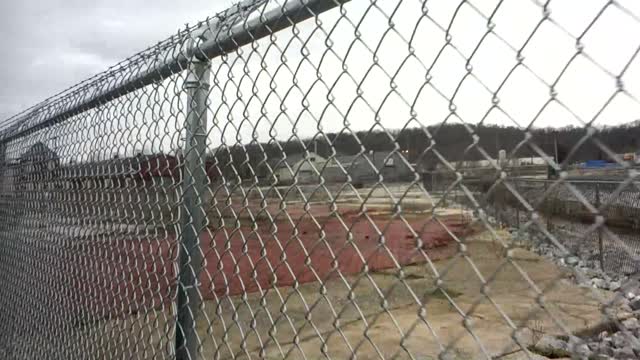 BARBED WIRE INWARD HOLDS PEOPLE INSIDE!