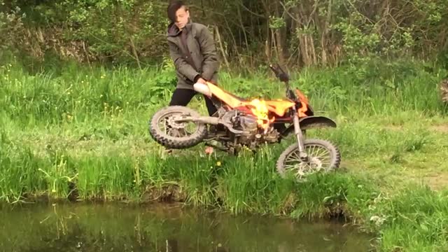 Boy Throws Flaming Dirt Bike into Lake and Retrieves it