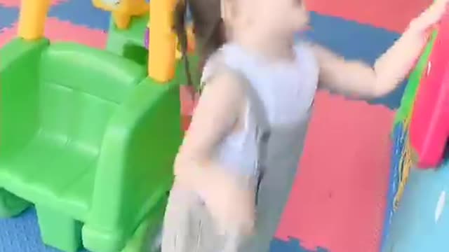 Cute baby playing climbing game