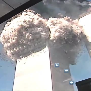 When slowing down this video footage from the world Trade Center on 9/11...