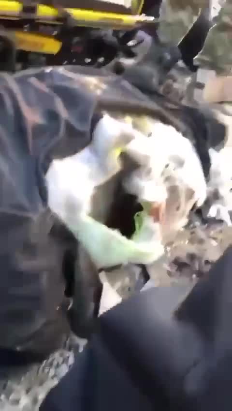 Rescue Workers Attempt to Free Those Trapped Under Rubble of Building Hit by Missile