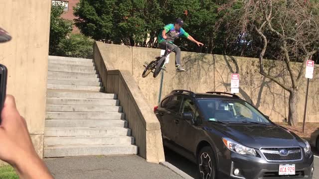 Biker Fails His Trick and Damages Car