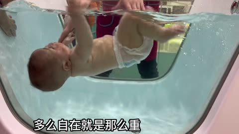 A baby who likes to swim