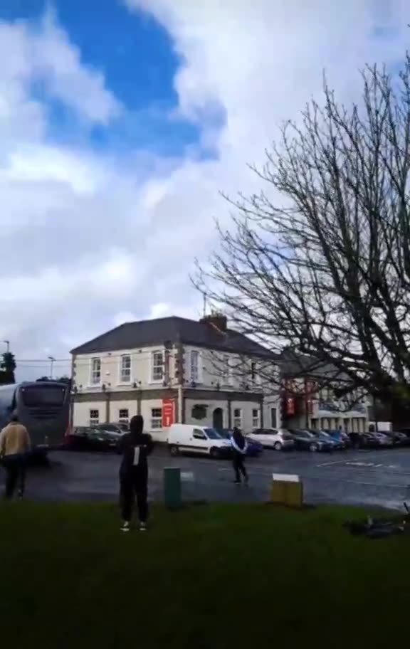 Cheers from the Irish outside of Collumb Barracks in Mullingar as a busload of fighting age...