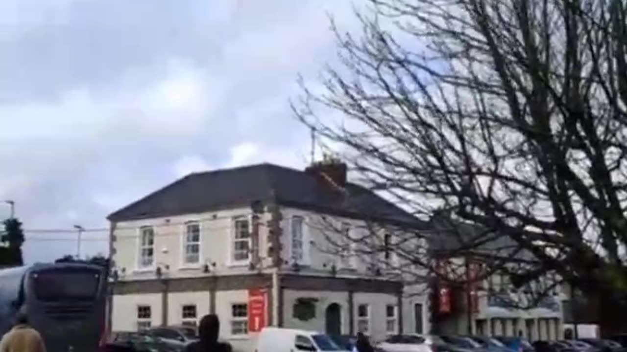 Cheers from the Irish outside of Collumb Barracks in Mullingar as a busload of fighting age...