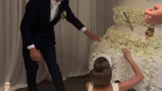 Groom Smashes Cake in Bride's Face