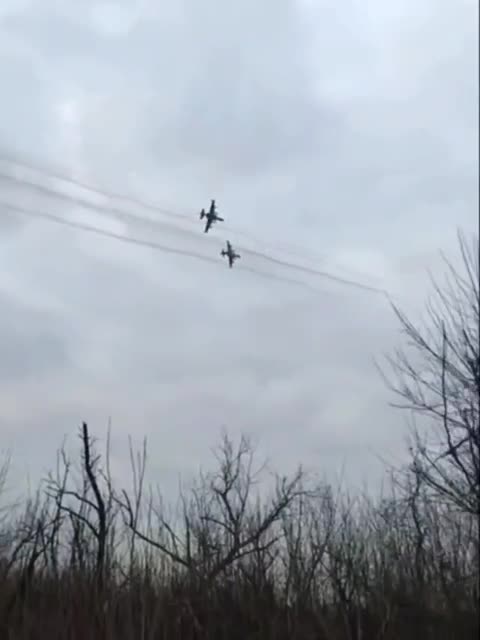 Two pairs of Russian Su-25s "pitching up"