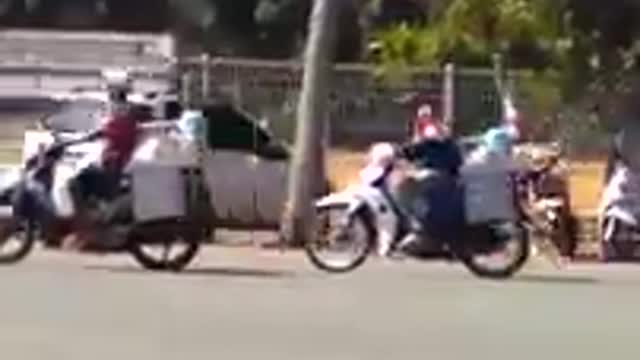 two guys bike racing with heavy load and crash