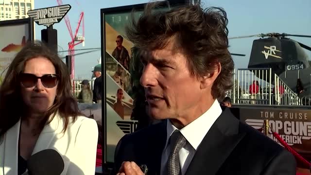 Tom Cruise flies onto aircraft carrier to launch new 'Top Gun' movie