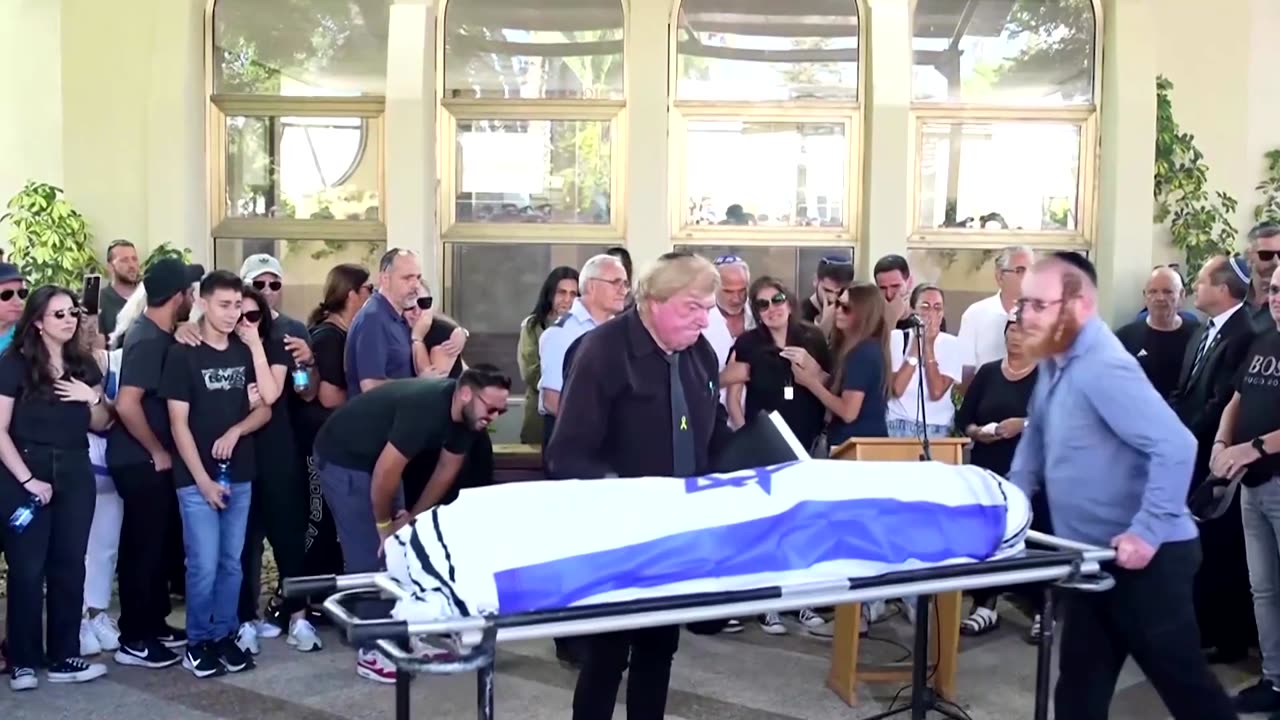 Parents of Israeli hostage mourn son's death at funeral