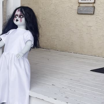 Scary entrance house decorate by Halloween scary dolls