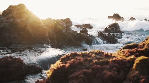 Water Crashing Over The Rocks