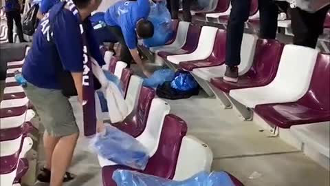 Japan fans clean up stadium after historic win over Germany