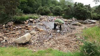 Washing my cup in stream. Dartmoor. GoPro.