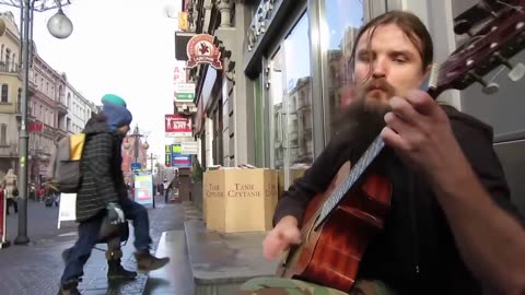 Street guitarist improvising fantastically.