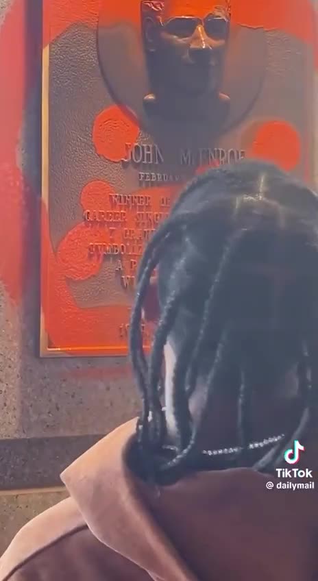 Travis Scott spray painting over John McEnroe‘s plaque why?