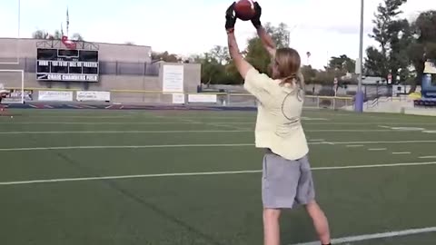 Trying to catch the FASTEST football ever thrown.