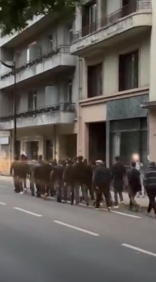 Nationalists patrolling the streets of Chambéry protecting property & businesses from rioting mobs