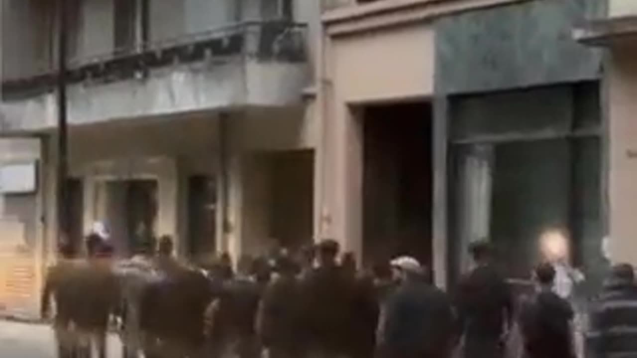 Nationalists patrolling the streets of Chambéry protecting property & businesses from rioting mobs