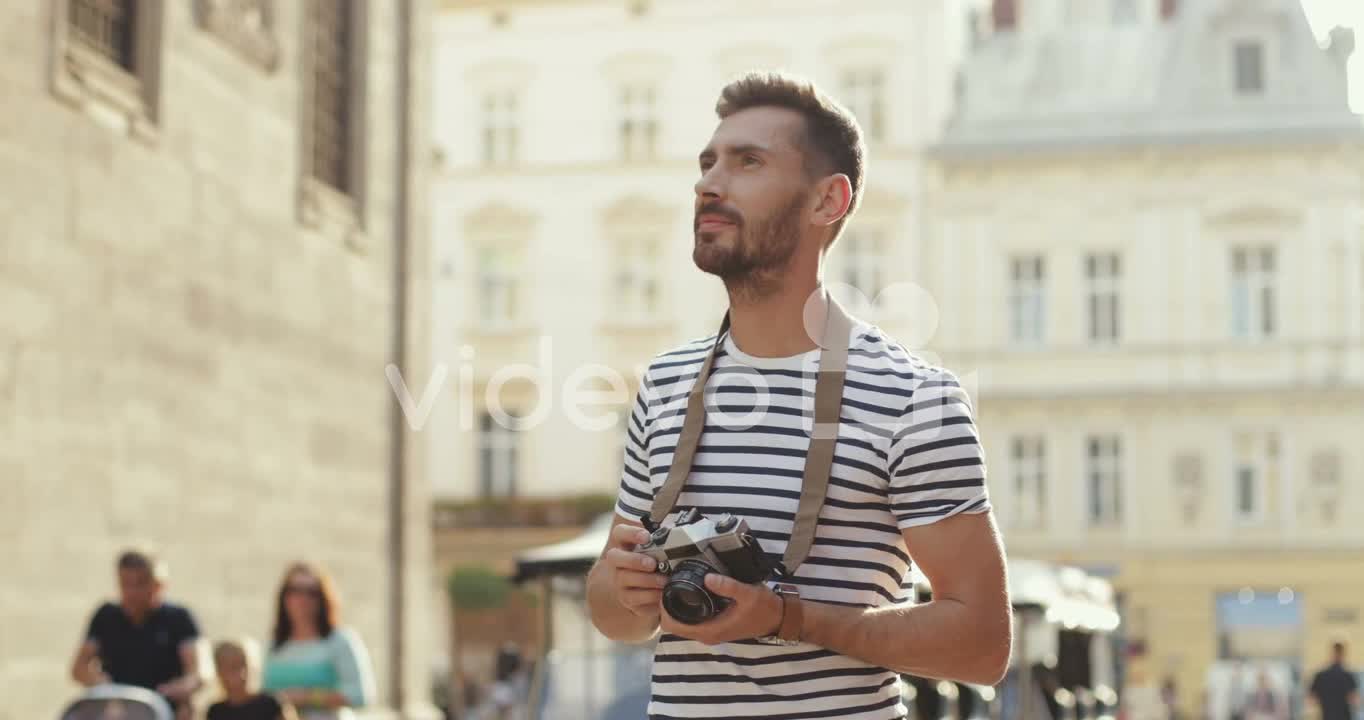 Handsome Man Taking Photos With A Camera In The Old Town