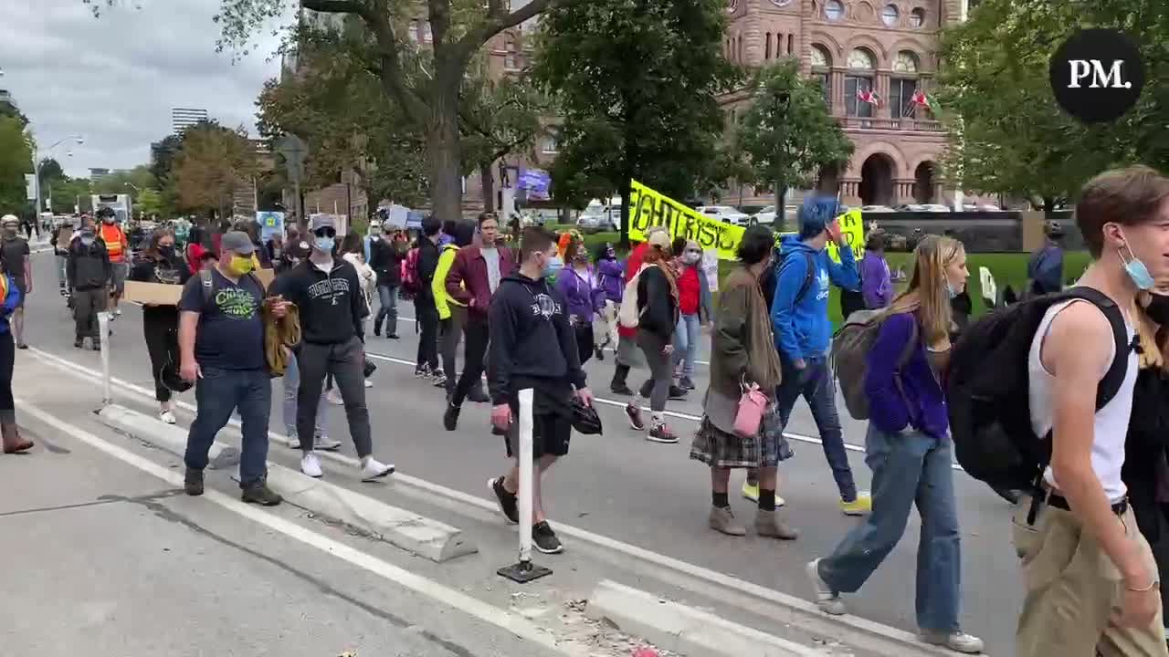 A large crowd of Climate Strike protestors depart Queen’s Park in Toronto