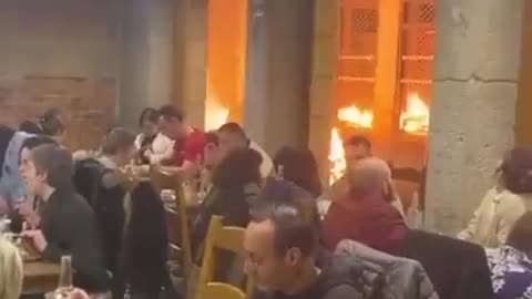 French Diners Eat Peacefully While Streets Burn