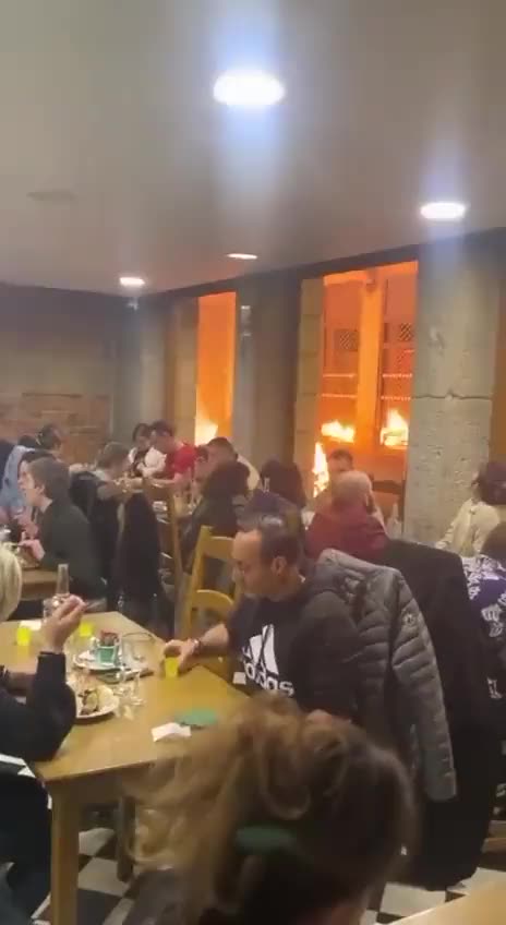French Diners Eat Peacefully While Streets Burn