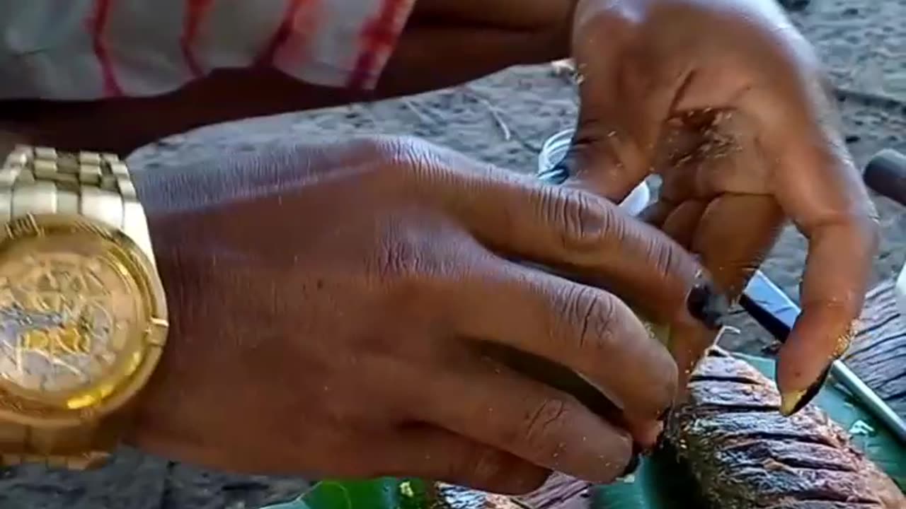 eating mackerel fish fried in palm oil