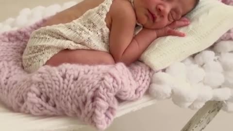 The lovely little angel laughed in her sleep