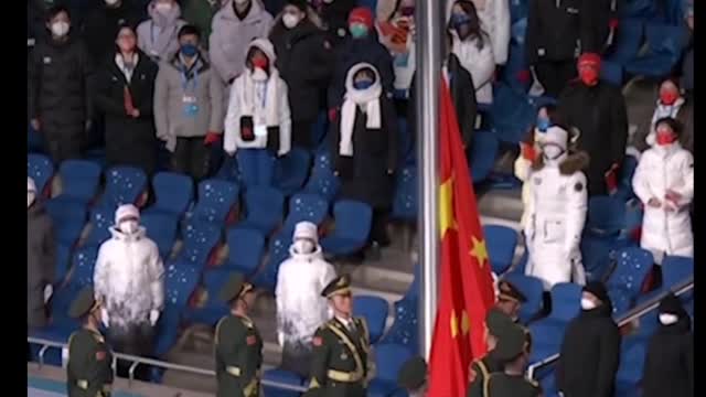 Raising the national flag and playing the national anthem at the opening ceremony