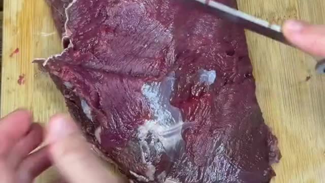 Cleaning up a bottom round roast from a deer