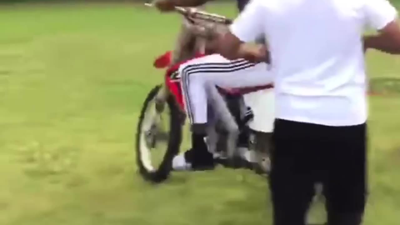 dude learning to ride motorbike takes off out of control