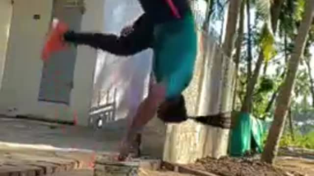Man Performs Backflip Over Bucket of Water