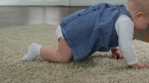 Baby Girl Crawling On The Floor