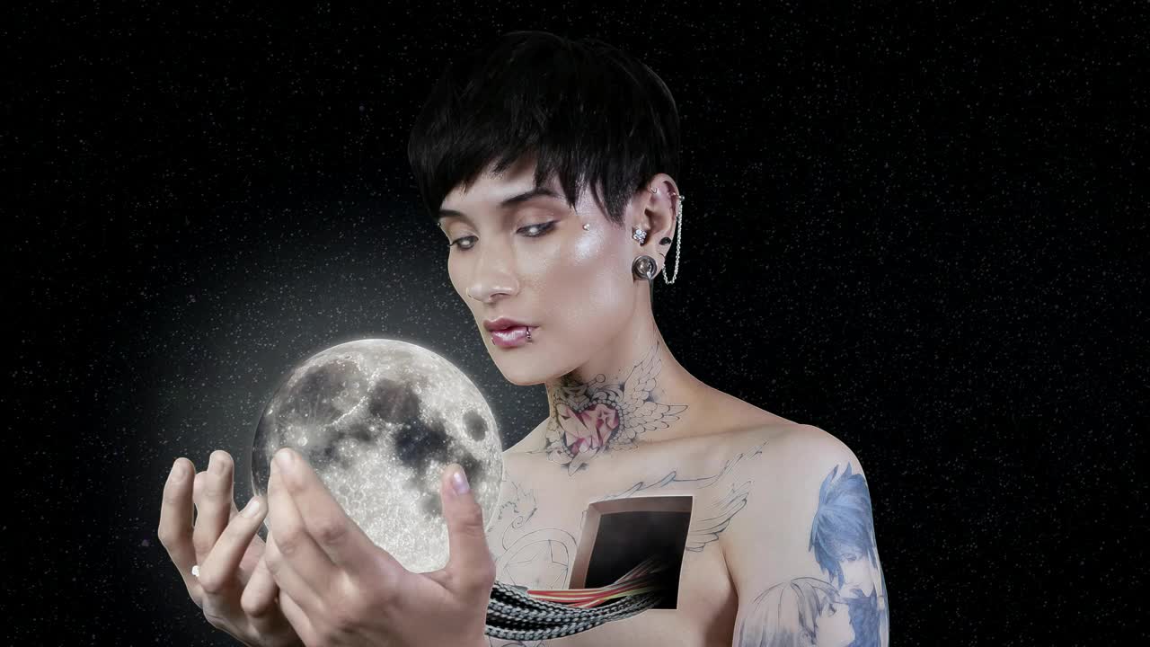 Abstract video of a woman holding the moon in her hands