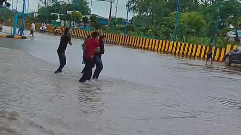 Indore India Some college kids were seen dancing in the rain on the road