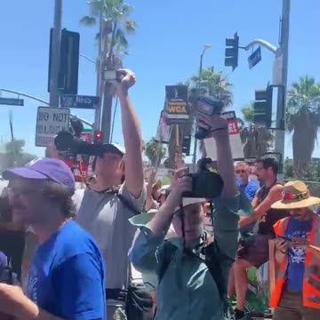 Protesters gather outside Netflix offices in LA as actors union joins striking writers