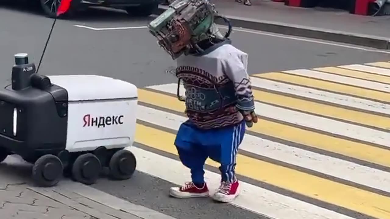 Gopnik robot takes another robot across the street in Moscow. 👀