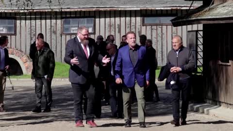 Schwarzenegger vows to fight hate during Auschwitz visit