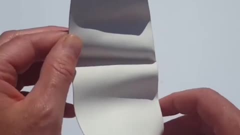 The folding of a face from a sheet of paper