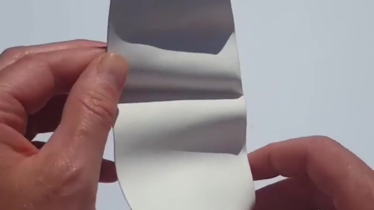 The folding of a face from a sheet of paper